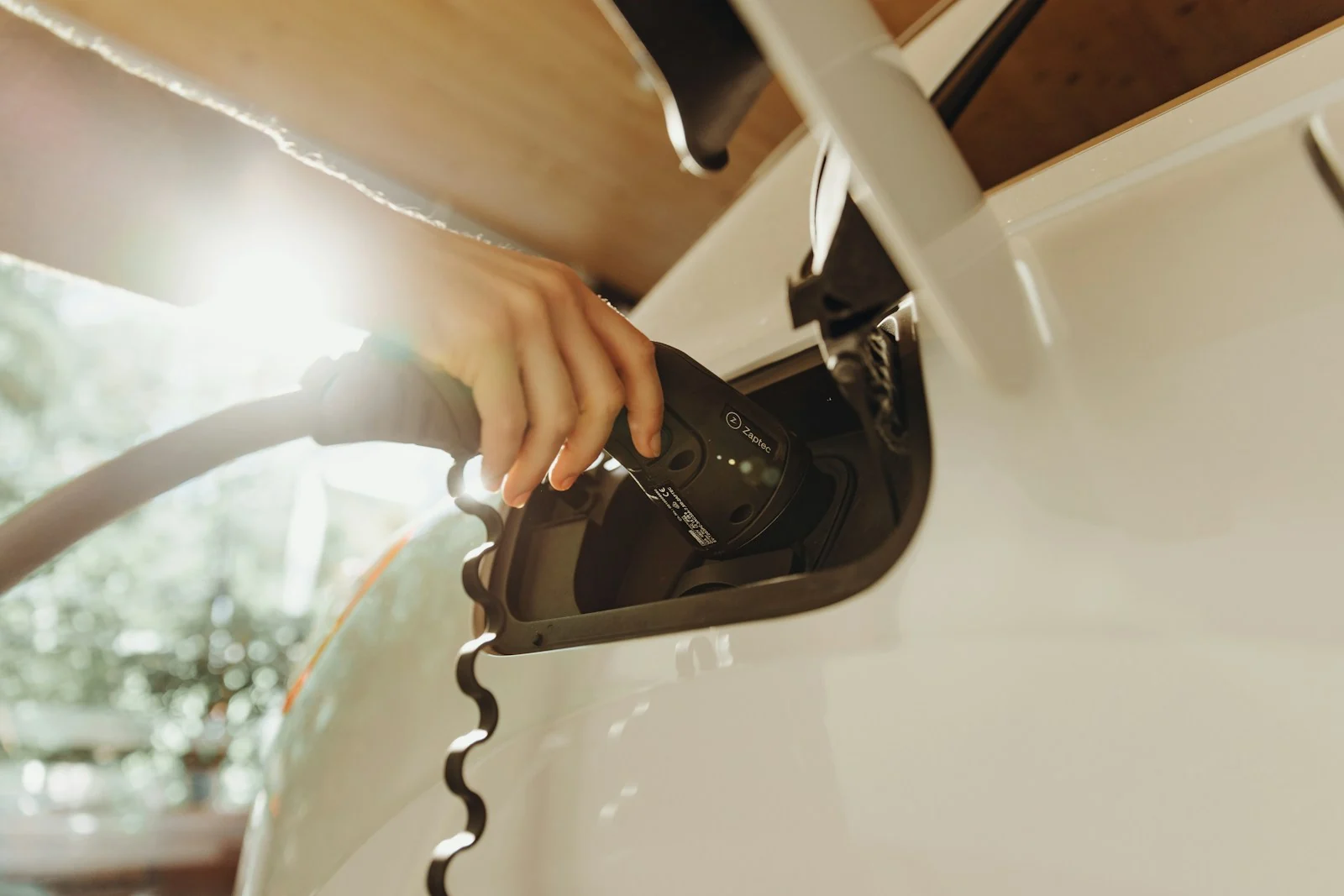 An electric vehicle connected to a charging cable